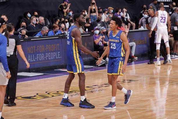 Jeff Dowtin of the Golden State Warriors high fives his teammate during the game against the Sacramento Kings 2021 California Classic Summer League...