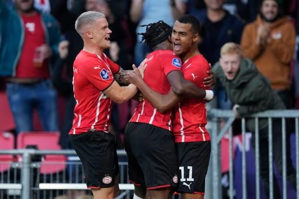 Cody Gakpo of PSV celebrates 3-0 with Philipp Max of PSV, Noni Madueke of PSV during the UEFA Champions League match between PSV v FC Midtjylland at...