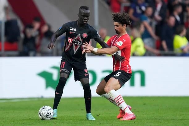 Awer Mabil of FC Midtjylland, Andre Ramalho of PSV during the UEFA Champions League match between PSV v FC Midtjylland at the Philips Stadium on...