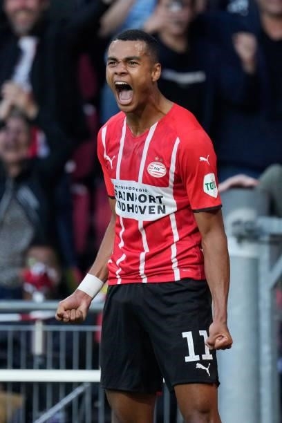 Cody Gakpo of PSV celebrates 3-0 during the UEFA Champions League match between PSV v FC Midtjylland at the Philips Stadium on August 3, 2021 in...