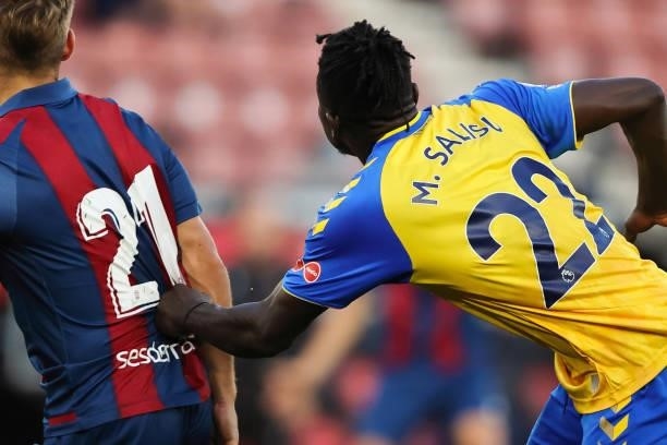 Mohammed Salisu of Southampton with Dani Gomez of Levante as the pair compete before the start of the 21-22 season during the pre-season friendly...