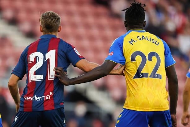 Mohammed Salisu of Southampton with Dani Gomez of Levante as the pair compete before the start of the 21-22 season during the pre-season friendly...