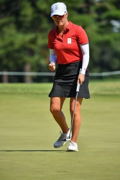 Belgium's Manon De Roey reacts after putting on the 13th green in round 2 of the womens golf individual stroke play during the Tokyo 2020 Olympic...