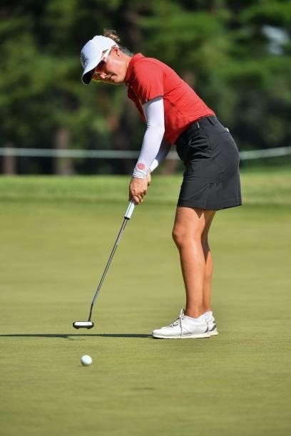 Belgium's Manon De Roey putts on the 13th green in round 2 of the womens golf individual stroke play during the Tokyo 2020 Olympic Games at the...