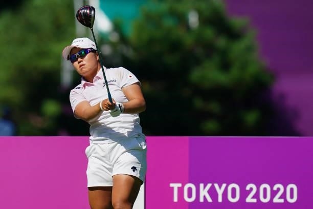 Japan's Nasa Hataoka watches her drive from the 18th tee in round 2 of the womens golf individual stroke play during the Tokyo 2020 Olympic Games at...
