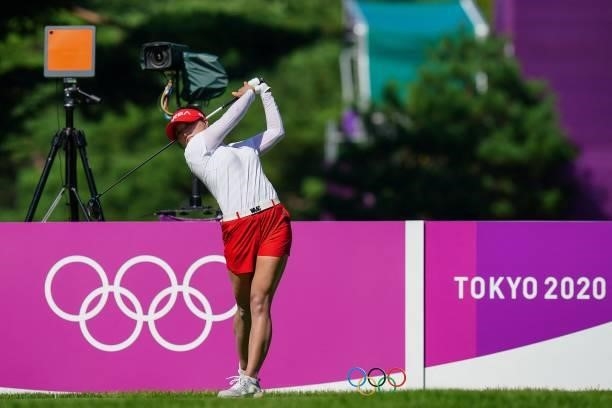 South Korea's Ko Jin Young watches her drive from the 18th tee in round 2 of the womens golf individual stroke play during the Tokyo 2020 Olympic...