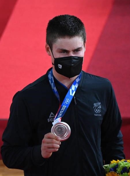 Silver medallist New Zealand's Campbell Stewart poses with his medal after the men's track cycling omnium event during the Tokyo 2020 Olympic Games...