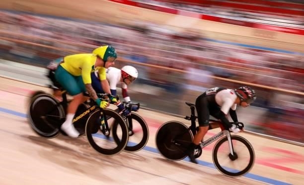 Japan's Eiya Hashimoto, Britain's Matthew Walls and Australia's Sam Welsford compete in the men's track cycling omnium points race during the Tokyo...