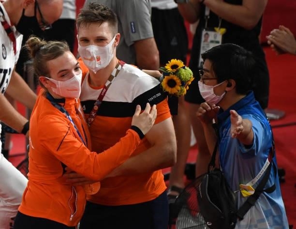 Gold medallist Netherlands' Shanne Braspennincx is hugged by partner and teammate Netherlands' Jeffrey Hoogland after the medal ceremony for the...
