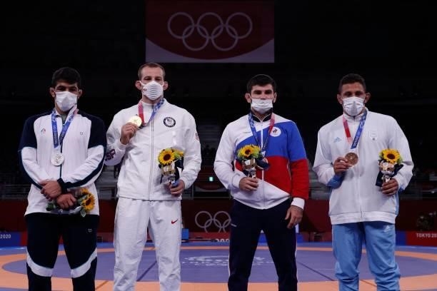 Silver medalist Iran's Hassan Yazdanicharati, gold medalist USA's David Morris Taylor Iii, bronze medalist Russia's Artur Naifonov and bronze...