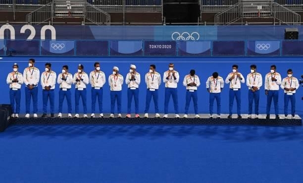 India's bronze medallists pose on the podium during the medal ceremony of the Tokyo 2020 Olympic Games men's field hockey competition, at the Oi...