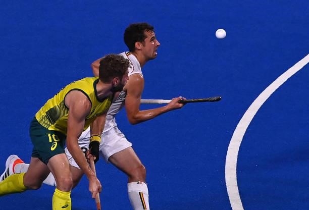 Belgium's Florent Van Aubel controls the ball next to Australia's Joshua Beltz during the men's gold medal match of the Tokyo 2020 Olympic Games...