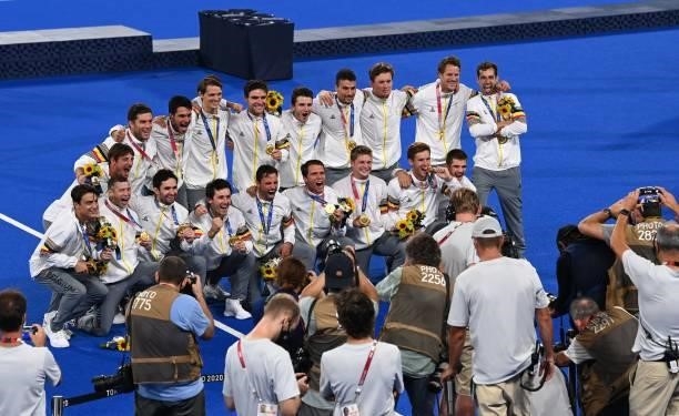 Belgium's gold medallists pose for the press during the medal ceremony of the Tokyo 2020 Olympic Games men's field hockey competition, at the Oi...