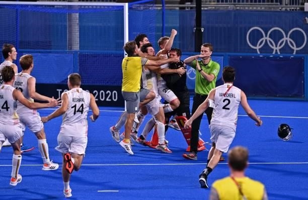 Players of Belgium celebrate during the penalty shoot-out against Australia during the men's gold medal match of the Tokyo 2020 Olympic Games field...