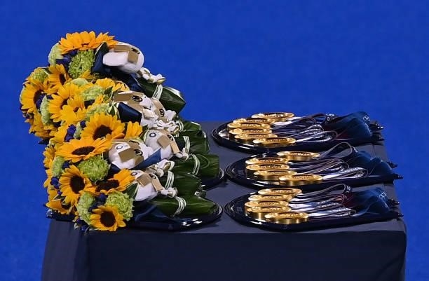 Picture of medals and bouquets taken during the medal ceremony of the Tokyo 2020 Olympic Games men's field hockey competition, at the Oi Hockey...