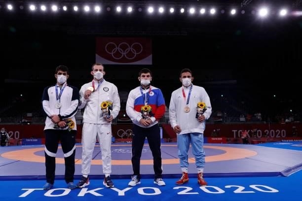 Silver medalist Iran's Hassan Yazdanicharati, gold medalist USA's David Morris Taylor Iii, bronze medalist Russia's Artur Naifonov and bronze...