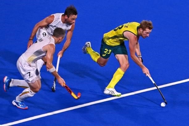 Australia's Daniel James Beale is challenged by Belgium's Sebastien Dockier and John-John Dominique Dohmen during the men's gold medal match of the...
