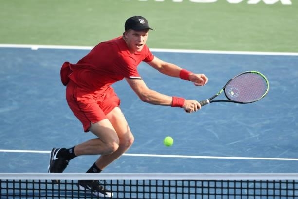 Jenson Brooksby of the United States returns a shot during a match against Felix Auger-Aliasime of Canada on Day 6 during the Citi Open at Rock Creek...