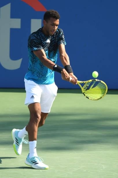 Felix Auger-Aliasime of Canada returns a shot during a match against Jenson Brooksby of the United States on Day 6 during the Citi Open at Rock Creek...