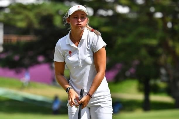 Denmark's Emily Kristine Pedersen reacts after her putt on the 18th green in round 3 of the womens golf individual stroke play during the Tokyo 2020...