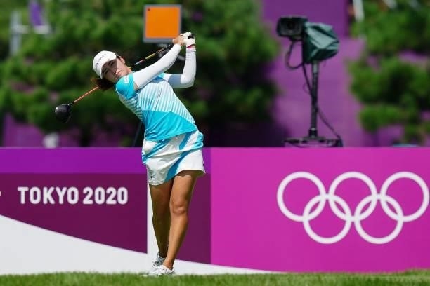 Japan's Mone Inami watches her drive from the 18th tee in round 3 of the womens golf individual stroke play during the Tokyo 2020 Olympic Games at...