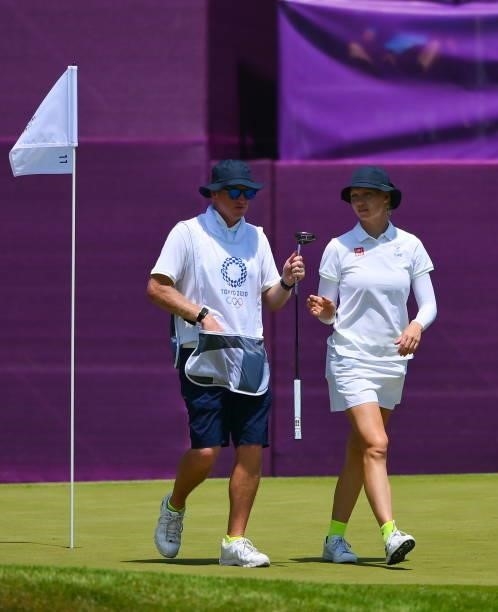 Saitama , Japan - 6 August 2021; Madelene Sagstrom of Sweden with her caddie Shane Codd during round three of the women's individual stroke play at...