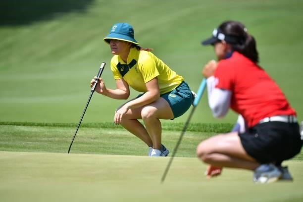 Australia's Hannah Green and South Korea's Ko Jin Young set up their putts on the 17th green in round 3 of the womens golf individual stroke play...