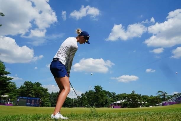 S Nelly Korda plays out of the rough by the side of the 18th fairway in round 3 of the womens golf individual stroke play during the Tokyo 2020...