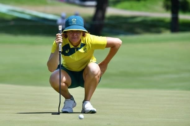 Australia's Hannah Green sets up her putt on the 18th green in round 3 of the womens golf individual stroke play during the Tokyo 2020 Olympic Games...