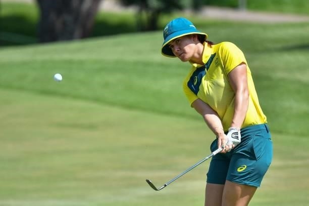 Australia's Hannah Green plays a shot on the 18th hole in round 3 of the womens golf individual stroke play during the Tokyo 2020 Olympic Games at...