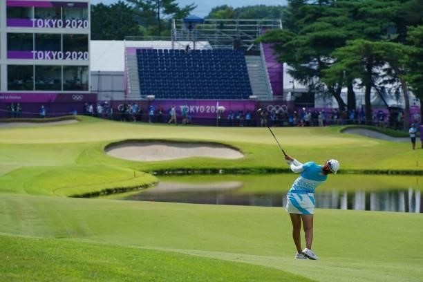 Japan's Mone Inami plays her approach shot to the 18th green in round 3 of the womens golf individual stroke play during the Tokyo 2020 Olympic Games...