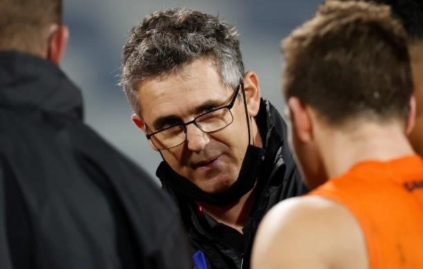 Leon Cameron, Senior Coach of the Giants addresses his players during the 2021 AFL Round 21 match between the Geelong Cats and the GWS Giants at...