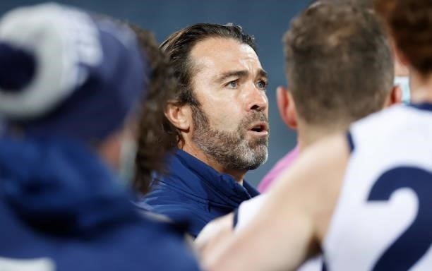 Chris Scott, Senior Coach of the Cats addresses his players during the 2021 AFL Round 21 match between the Geelong Cats and the GWS Giants at GMHBA...