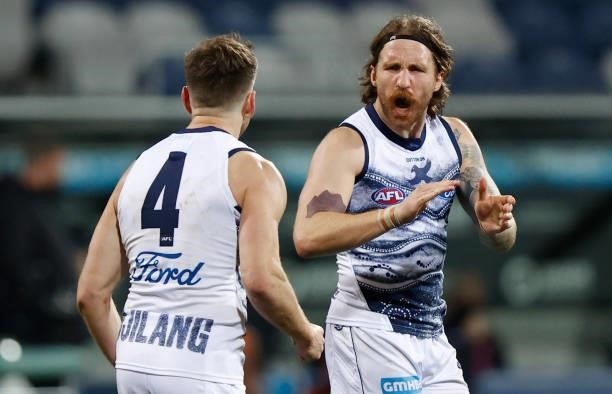 Shaun Higgins and Zach Tuohy of the Cats celebrate during the 2021 AFL Round 21 match between the Geelong Cats and the GWS Giants at GMHBA Stadium on...