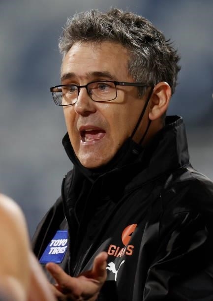 Leon Cameron, Senior Coach of the Giants addresses his players during the 2021 AFL Round 21 match between the Geelong Cats and the GWS Giants at...