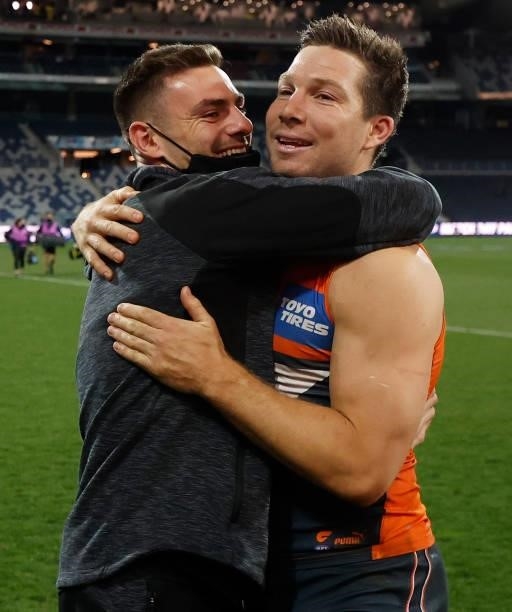 Stephen Coniglio and Toby Greene of the Giants celebrate during the 2021 AFL Round 21 match between the Geelong Cats and the GWS Giants at GMHBA...