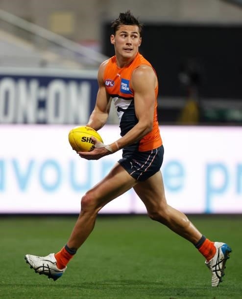 Isaac Cumming of the Giants in action during the 2021 AFL Round 21 match between the Geelong Cats and the GWS Giants at GMHBA Stadium on August 6,...