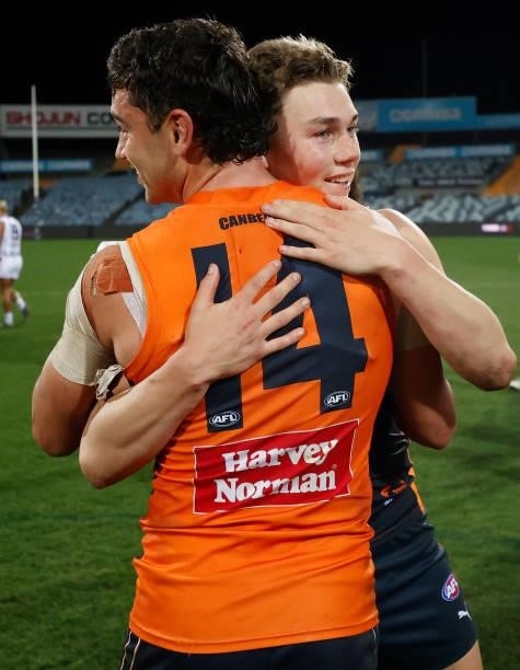 Tim Taranto and Tanner Bruhn of the Giants celebrate during the 2021 AFL Round 21 match between the Geelong Cats and the GWS Giants at GMHBA Stadium...