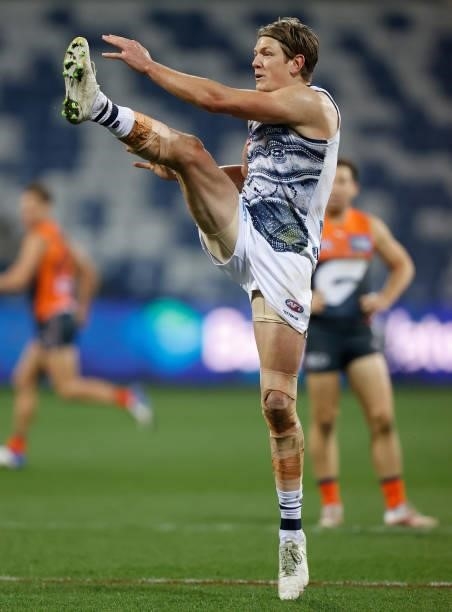 Rhys Stanley of the Cats kicks the ball during the 2021 AFL Round 21 match between the Geelong Cats and the GWS Giants at GMHBA Stadium on August 6,...