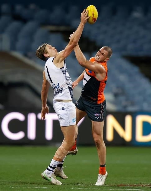Rhys Stanley of the Cats and Kieren Briggs of the Giants compete for the ball during the 2021 AFL Round 21 match between the Geelong Cats and the GWS...