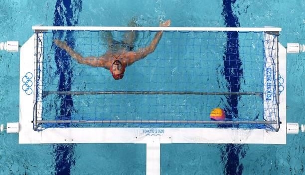 An overview shows Spain's goalkeeper Daniel Lopez Pinedo reacts after conceding a goal during the Tokyo 2020 Olympic Games men's water polo...