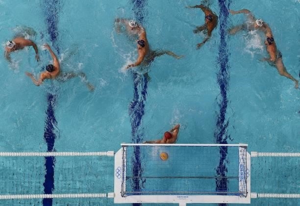 An overview shows Spain's goalkeeper Daniel Lopez Pinedo concede a goal during the Tokyo 2020 Olympic Games men's water polo semi-final match between...