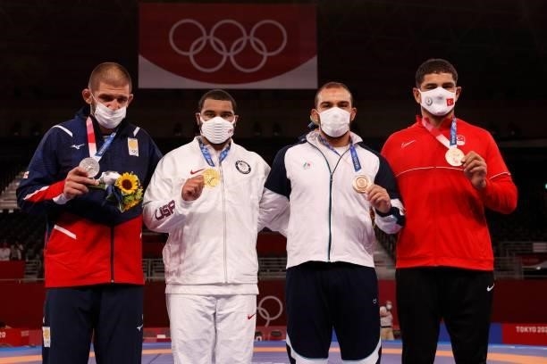 Silver medalist Georgia's Geno Petriashvili, gold medalist USA's Gable Dan Steveson, bronze medalist Iran's Amir Hossein Zare and bronze medalist...