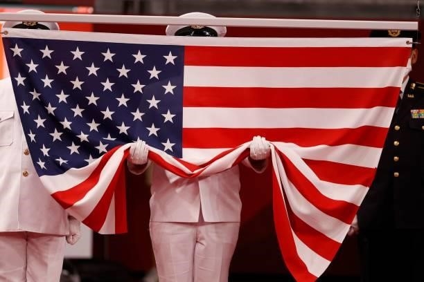 The United States of America national flag is prepared to be raised before the medal ceremony after the men's freestyle 125kg wrestling competition...
