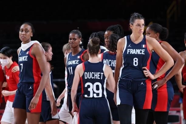 French players react after losing the women's semi-final basketball match between Japan and France during the Tokyo 2020 Olympic Games at the Saitama...