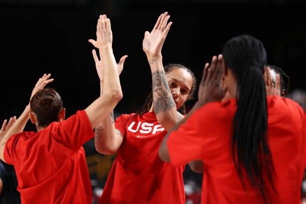 Brittney Griner of the USA Women's National Team high-fives teammates before the game against the Serbia Women's National Team during semifinals of...