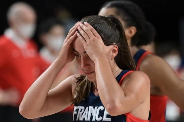 France's Marine Fauthoux reacts after their defeat in the women's semi-final basketball match between Japan and France during the Tokyo 2020 Olympic...