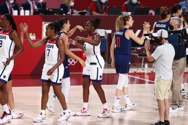 Chelsea Gray of the USA Women's National Team high-fives Serbia Women's National Team players after the game during semifinals of the 2020 Tokyo...