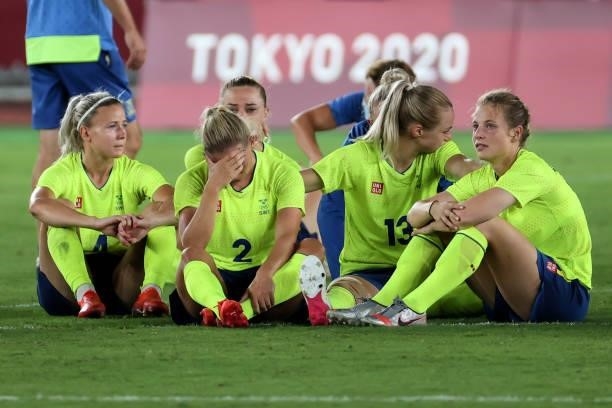Team Sweden reacts after losing to Team Canada in a penalty kick shoot-out during the women's football gold medal match between Canada and Sweden on...