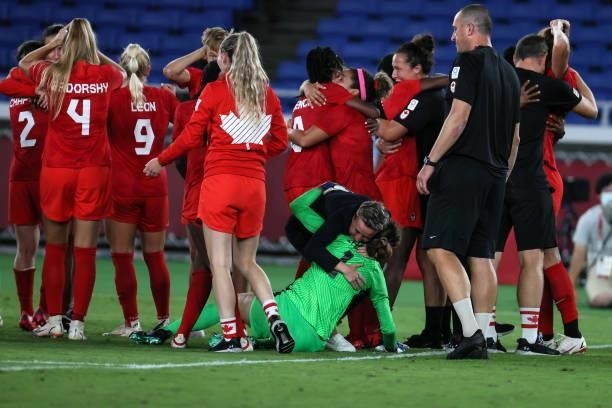 Players of Team Canada celebrate following their team's victory in the penalty shoot out in the Women's Gold Medal Match between Canada and Sweden on...